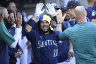 Seattle Mariners' Eugenio Suarez celebrates his home run against the Chicago White Sox during the seventh inning of a baseball game Wednesday, Sept. 7, 2022, in Seattle. (AP Photo/Caean Couto)