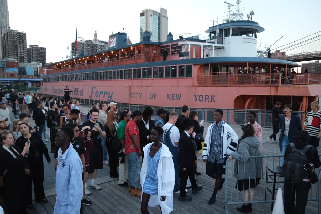 Models leave the MV John F. Kennedy ferryboat at Pier 17 at the end of a Tommy Hilfiger spring 2025 show on Sunday. James Keivom