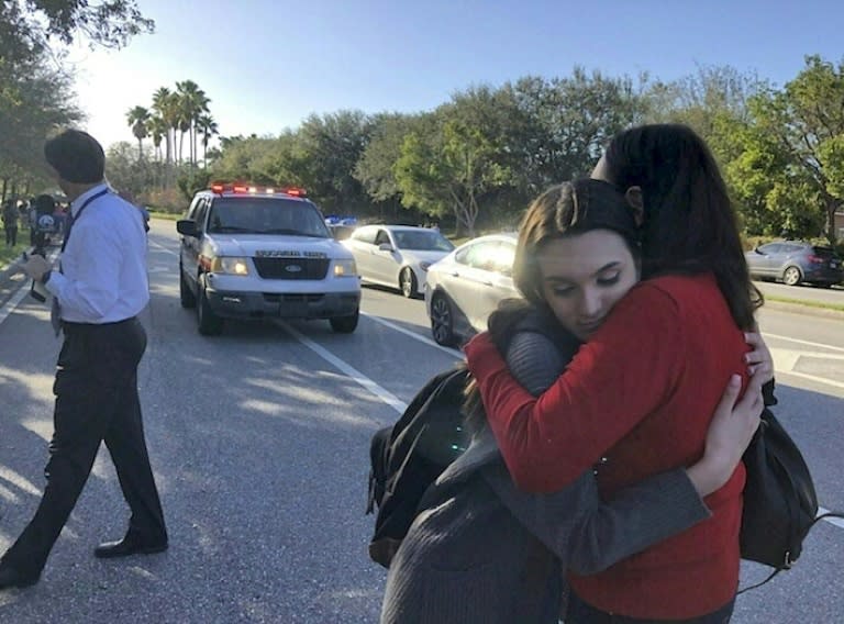 Students embrace each other after the shooting