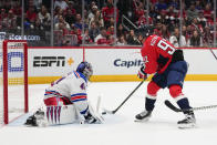 Washington Capitals center Evgeny Kuznetsov (92) controls the puck before scoring on New York Rangers goaltender Jaroslav Halak (41) during the third period of an NHL hockey game, Saturday, Feb. 25, 2023, in Washington. The Capitals won 6-3. (AP Photo/Julio Cortez)