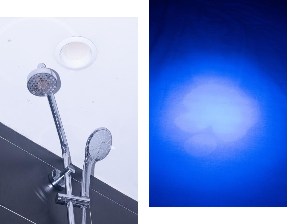 Photos from the hotel show a showerhead and blue light revealing a stain on fabric