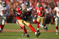 SAN FRANCISCO, CA - NOVEMBER 13: Delanie Walker #46 of the San Francisco 49ers is tackled by Kenny Phillips #21 of the New York Giants at Candlestick Park on November 13, 2011 in San Francisco, California. (Photo by Ezra Shaw/Getty Images)