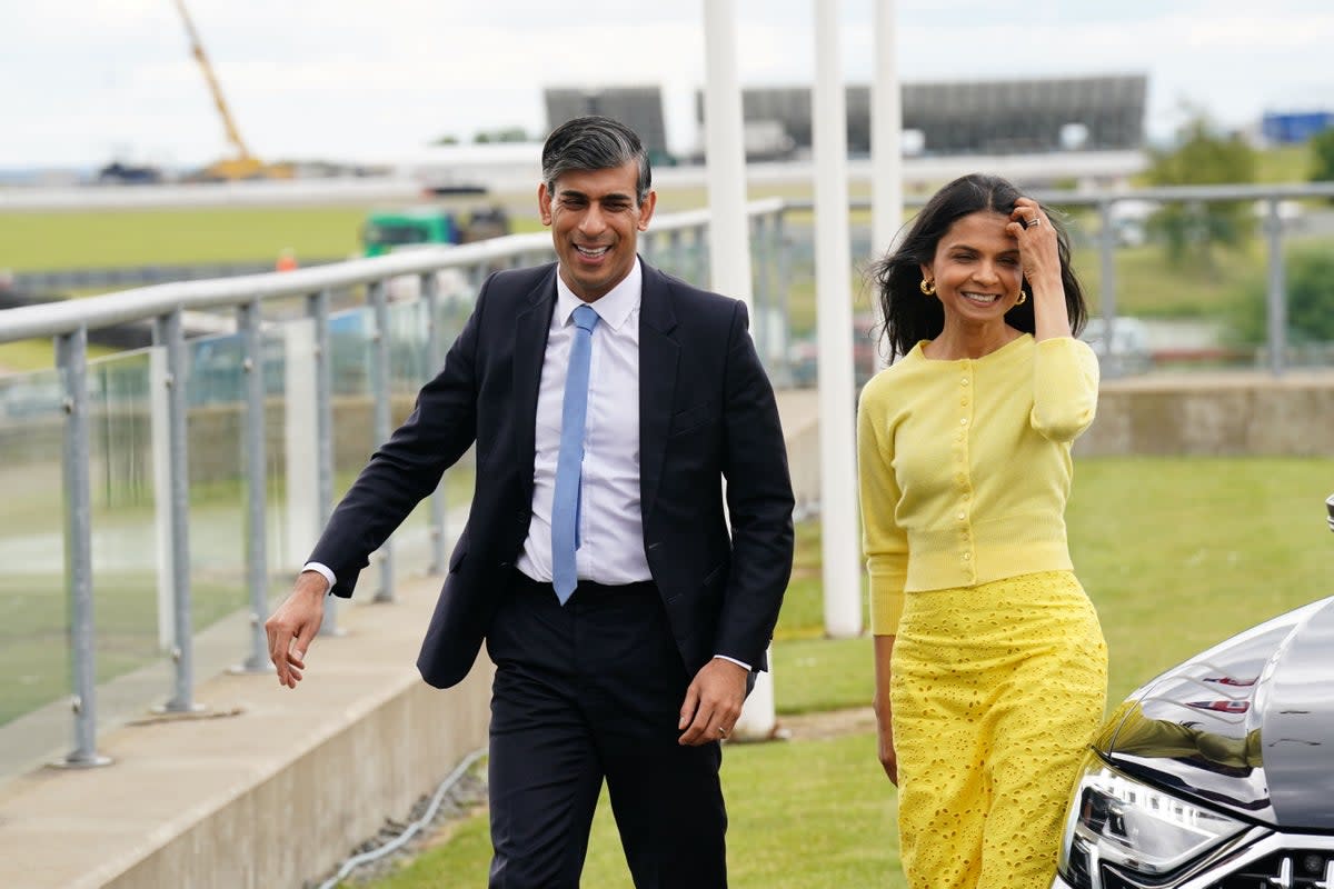 Prime Minister Rishi Sunak and wife Akshata Murty at the launch of the Conservative Party General Election manifesto at Silverstone (James Manning/PA) (PA Wire)