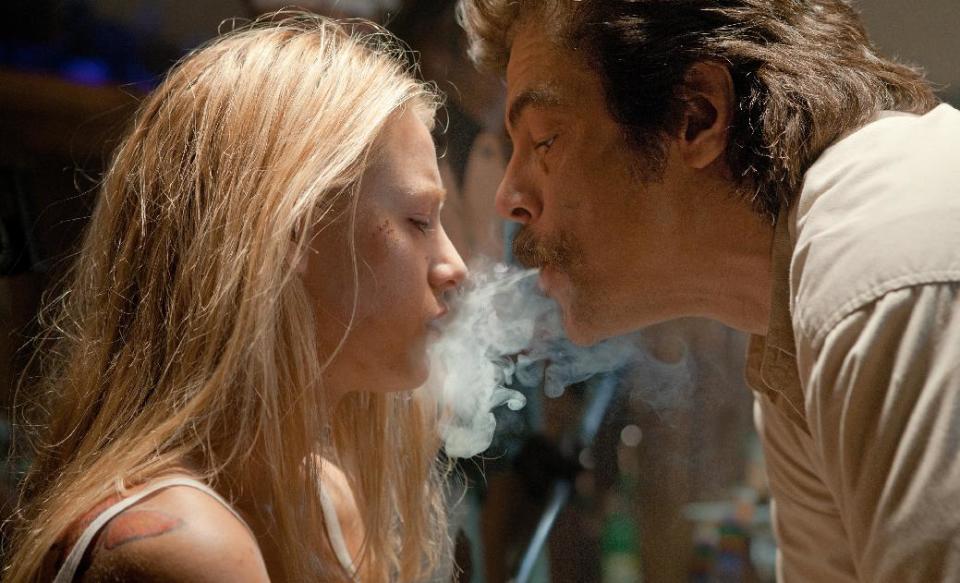 This film image released by Universal Pictures shows Blake Lively, left, and Benicio Del Toro in a scene from "Savages." (AP Photo/Universal Pictures, Francois Duhamel)