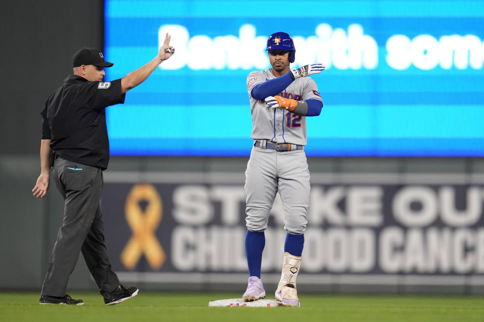 New York Mets' Francisco Lindor (12) celebrates after hitting a two-run, ground-rule double against the Minnesota Twins during the fourth inning of a baseball game Friday, Sept. 8, 2023, in Minneapolis. (AP Photo/Abbie Parr)