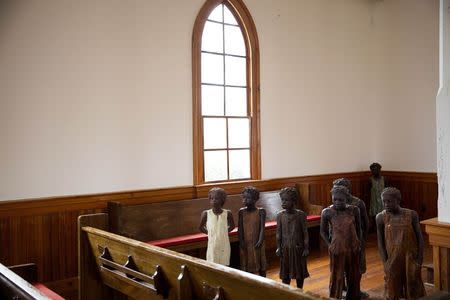 Terra-cotta statues of child slaves are inside of a church at the Whitney Plantation in Wallace, Louisiana January 13, 2015. REUTERS/Edmund Fountain