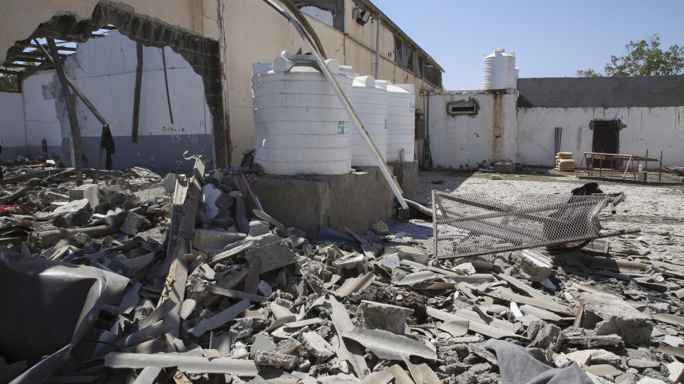 Debris covers the ground after an airstrike at a detention center in Tajoura, east of Tripoli in Libya, Wednesday, July 3, 2019. An airstrike hit the detention center for migrants early Wednesday, killing several. (AP Photo/Hazem Ahmed)