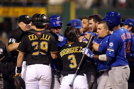 Oct 7, 2015; Pittsburgh, PA, USA; Pittsburgh Pirates first baseman Sean Rodriguez (3) goes after Chicago Cubs catcher David Ross (center) after Chicago Cubs starting pitcher Jake Arrieta (49) was hit by a pitch during the seventh inning in the National League Wild Card playoff baseball game at PNC Park. Charles LeClaire-USA TODAY Sports