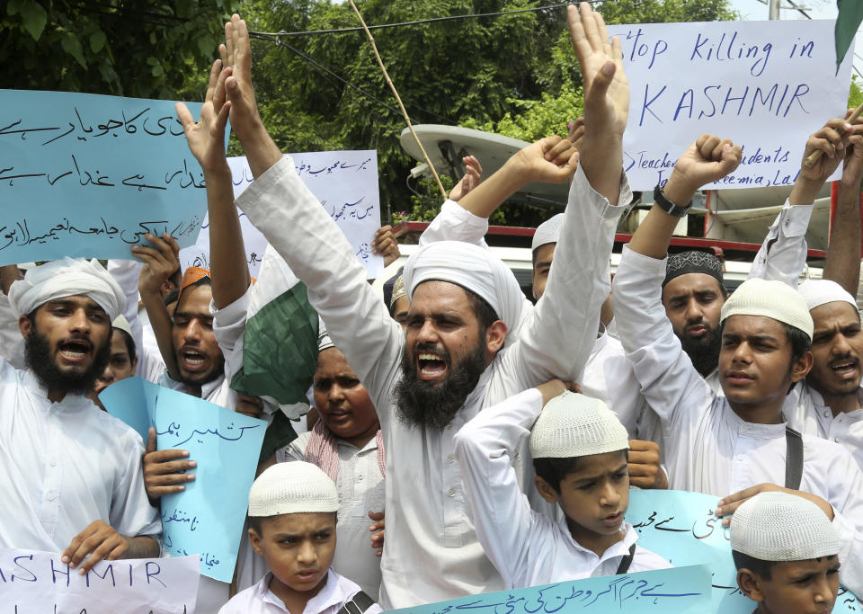 Pakistani religious students attend an anti-Indian rally in Lahore, Pakistan, Wednesday, Aug. 7, 2019. Pakistan has decided to downgrade its diplomatic ties with neighboring India and suspend bilateral trade in response to New Delhi's decision to reduce the special status of Kashmir, a Himalayan region claimed by both countries. (AP Photo/K.M. Chaudary)