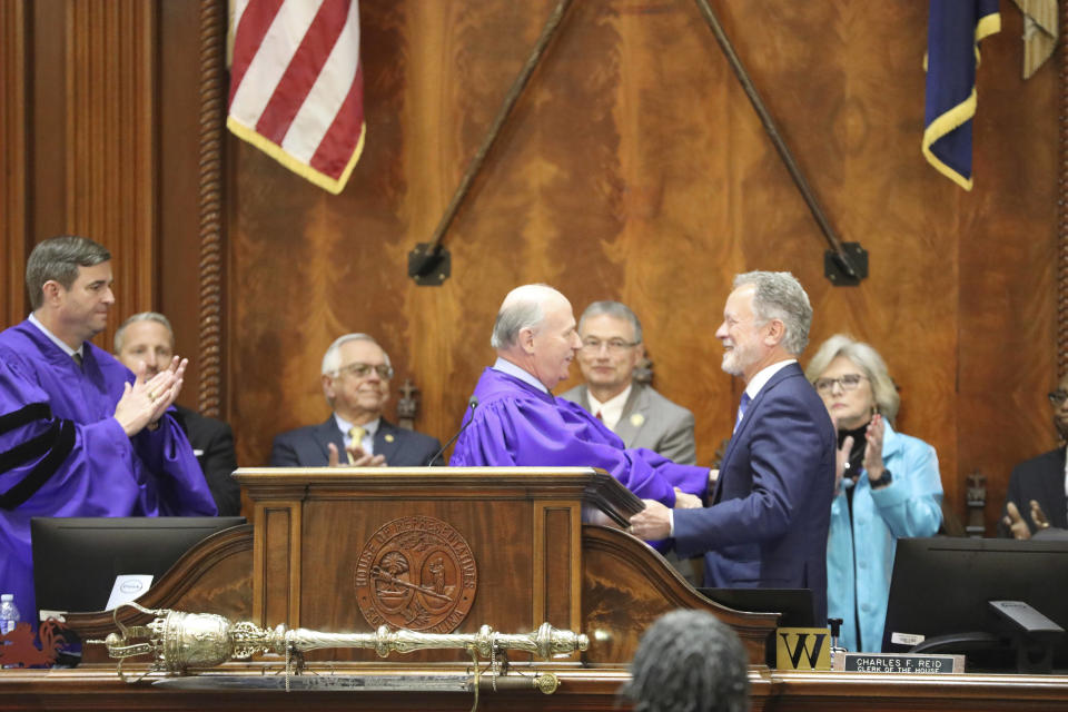 Former United Nations World Food Program Executive Director and Nobel Peace Prize winner David Beasley, right, shakes hands with Senate President Thomas Alexander, left before Beasley speaks to the South Carolina General Assembly on Wednesday, May 2, 2023 in Columbia, S.C. Beasley was governor of South Carolina from 1995 to 1999. (AP Photo/Jeffrey Collins)