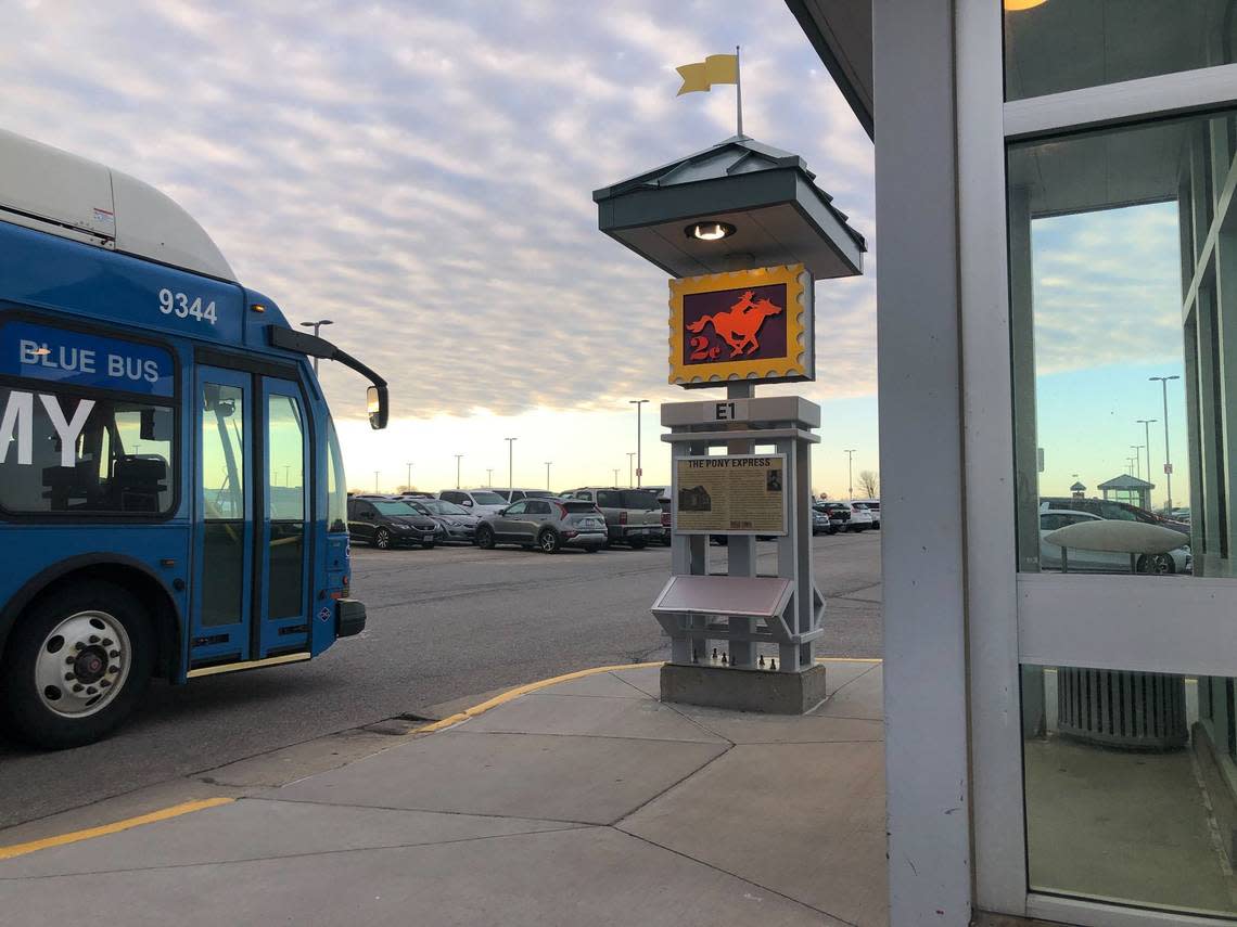 A Kansas City International Airport parking lot shuttle bus pulls up to a stand in Economy Parking Lot A. Early on opening day for the new terminal, buses were passing by every 6-7 minutes.