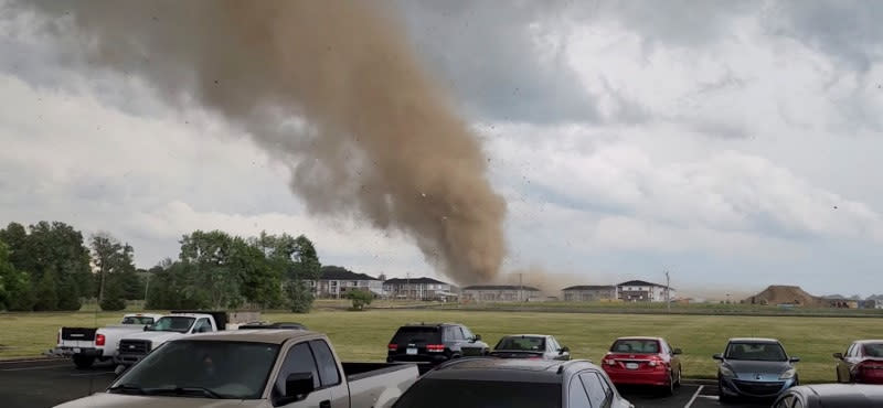 Debris is lifted into the air by a possible tornado near Greenwood, Indiana