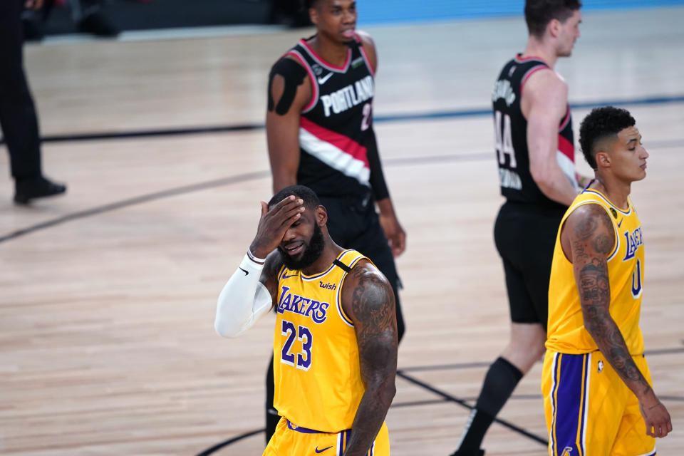 LeBron James reacts during the Lakers' Game 1 loss to the Blazers. (Ashley Landis-Pool/Getty Images)