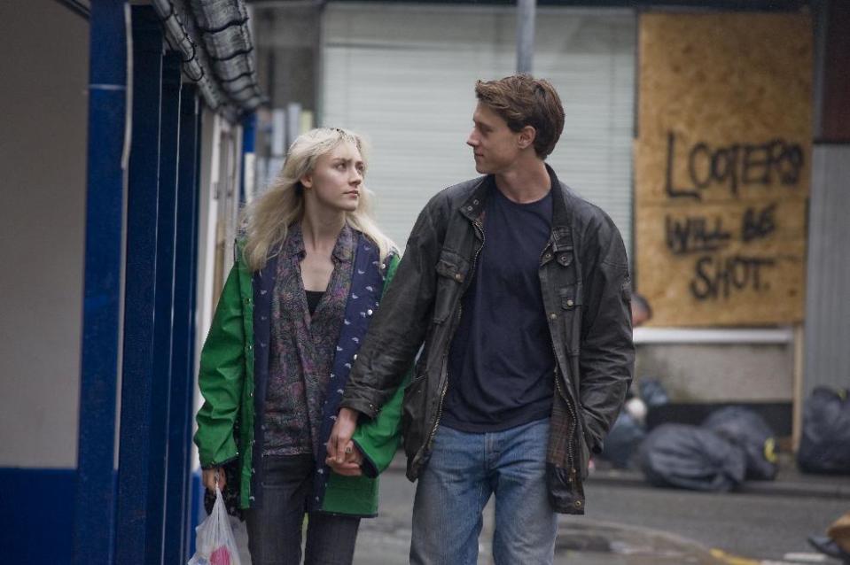 This image released by Magnolia Pictures shows Saoirse Ronan, left, and George MacKay in a scene from "How I Live Now." (AP Photo/Magnolia Pictures)