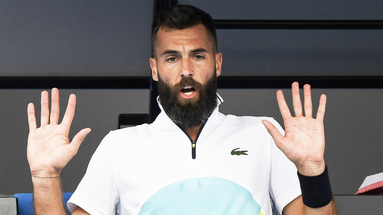 French star Benoit Paire putting his hands up on the bench.