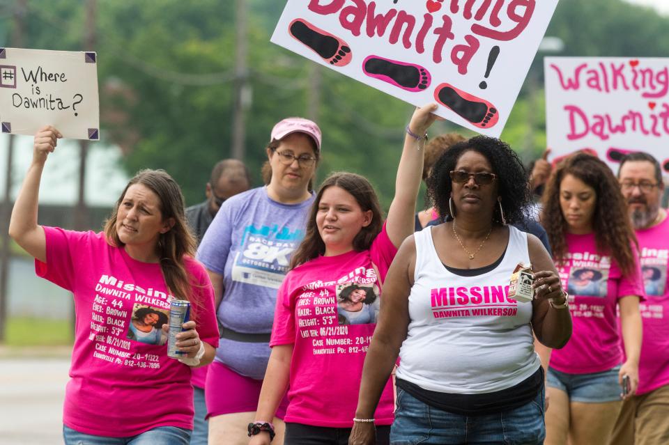 Family and friends walk along Boeke Road to raise awareness on the one-year mark since Dawnita Wilkerson went missing from Evansville, Ind., Saturday morning, June 19, 2021. Wilkerson was last seen on June 21, 2020, and a missing person investigation is ongoing.
