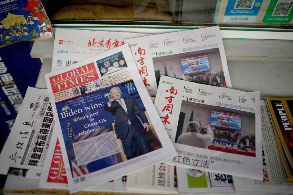 Image: Newspaper front pages at a news stand in Beijing on Nov. 9. (Noel Celis / AFP via Getty Images file)