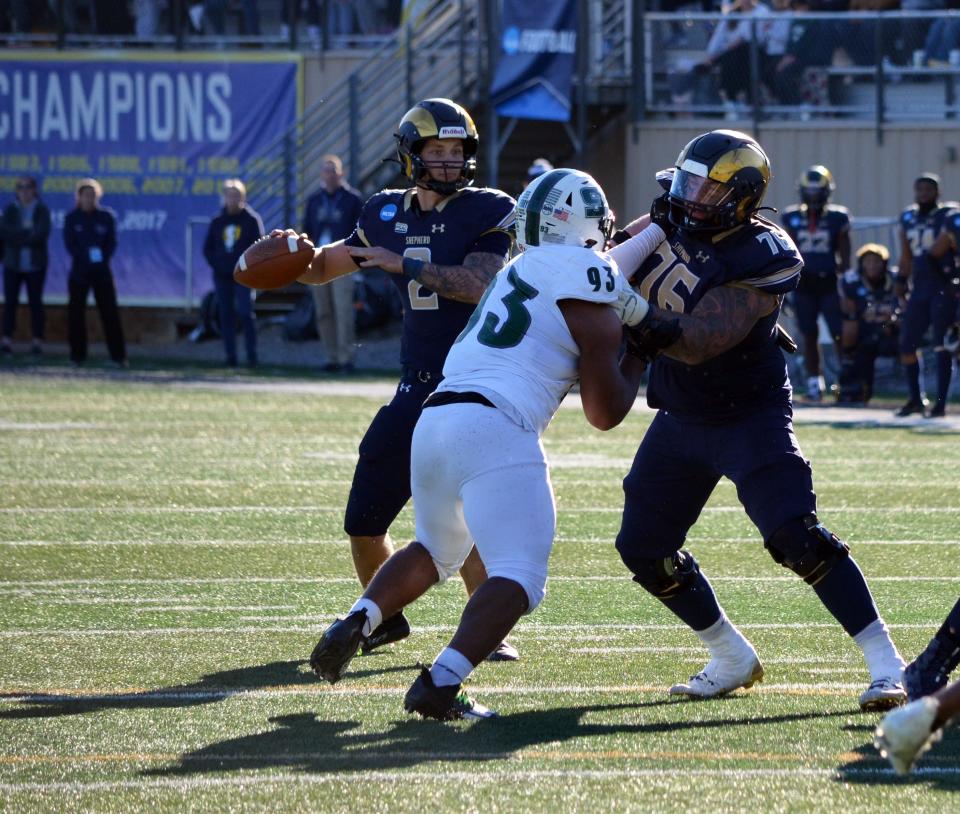 Shepherd quarterback Tyson Bagent is protected by lineman Joey Fisher as he looks to pass against Slippery Rock in their NCAA Division II second-round playoff game.