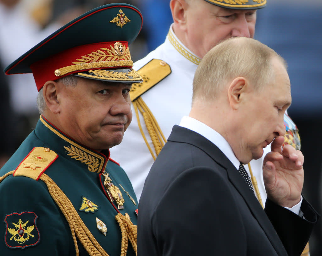 Russian President Vladimir Putin (R) and Defense Minister Sergei Shoigu (L) seen during the Navy Day Parade.