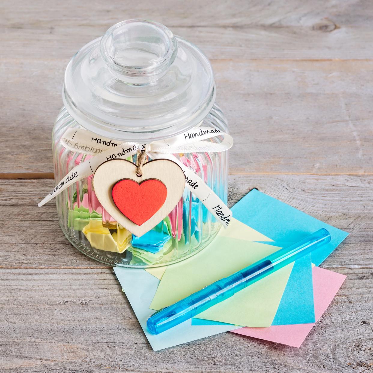 glass jar filled with notes