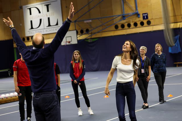 <p>Suzanne Plunkett - WPA Pool/Getty Images</p> Prince William and Kate Middleton play netball on Oct. 12, 2023