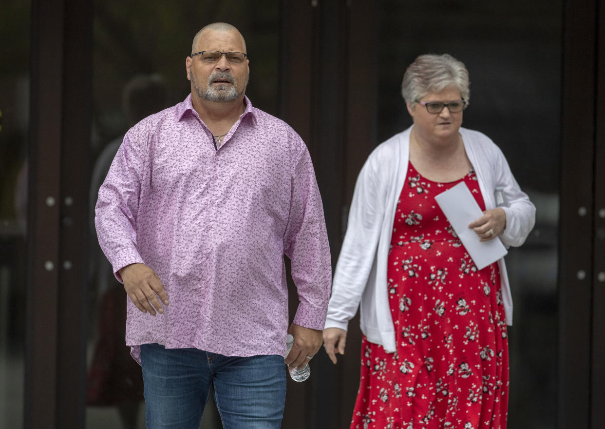 Dean and Hilda Reckard, brother and sister-in-law of Margie Reckard, who died in the Walmart mass shooting, exit the federal court at the end of the second day of the sentencing hearing for perpetrator Patrick Crusius in El Paso, Texas, Thursday, July 6, 2023. Nearly four years after a white gunman killed 23 people at a Walmart in El Paso in a racist attack that targeted Hispanic shoppers, relatives of the victims are packing a courtroom near the U.S.-Mexico border this week to see Crusius punished for one of the nation's worst mass shootings. (AP Photo/Andrés Leighton)