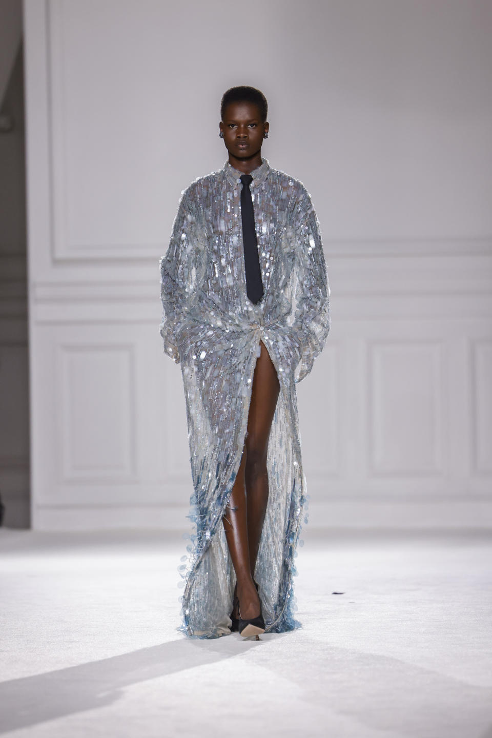 A model wears a creation as part of the Valentino Fall/Winter 2023-2024 ready-to-wear collection presented Sunday, March 5, 2023 in Paris. (Vianney Le Caer/Invision/AP)