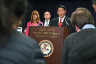 U.S. Attorney Robert K. Hur, center, speaks at a press conference announcing the indictment of former Baltimore Mayor Catherine Pugh, Wednesday, Nov. 20, 2019, in Baltimore. Pugh was charged Wednesday with fraud and tax evasion involving sales of her self-published children's books. (Lloyd Fox/The Baltimore Sun via AP)