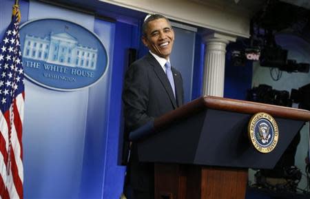 U.S. President Barack Obama reacts to a question during his year-end news conference in the White House briefing room in Washington, December 20, 2013. REUTERS/Jonathan Ernst