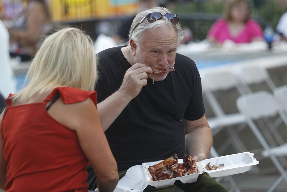 Marilyn and Drew Gelatt enjoy some ribs July 29. Patrons were able to choose from four rib masters.