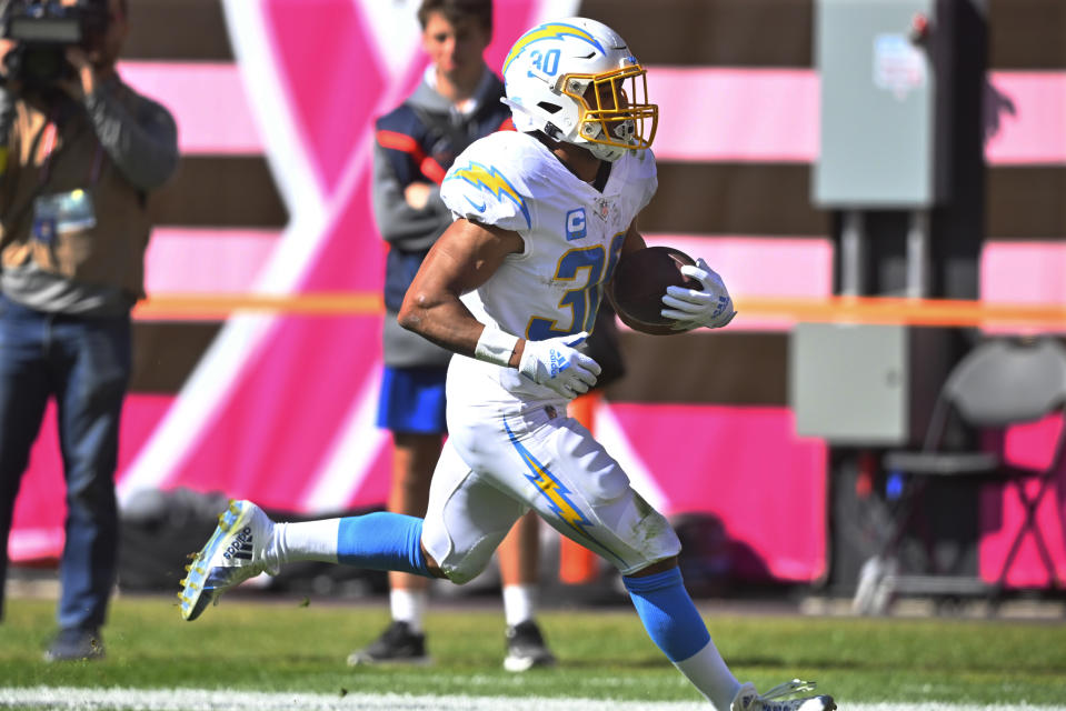 Los Angeles Chargers running back Austin Ekeler (30) runs in for a touchdown against the Cleveland Browns during the first half of an NFL football game, Sunday, Oct. 9, 2022, in Cleveland. (AP Photo/David Richard)