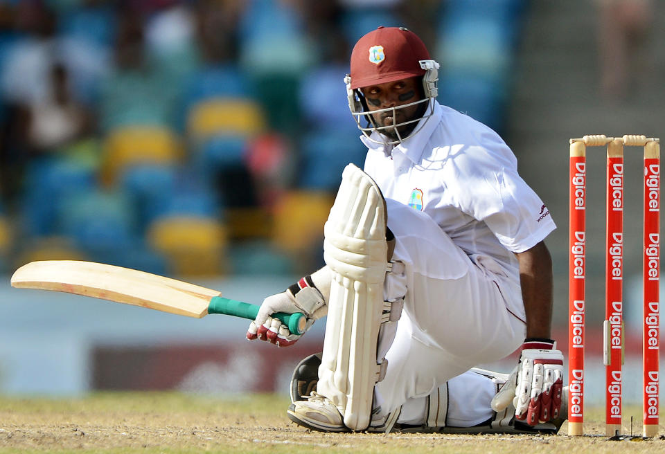 West Indies batsman Narsingh Deonarine falls on the pitch as he plays a shot during the fourth day of the first-of-three Test matches between Australia and West Indies at the Kensington Oval stadium in Bridgetown on April 10, 2012. AFP PHOTO/Jewel Samad (Photo credit should read JEWEL SAMAD/AFP/Getty Images)