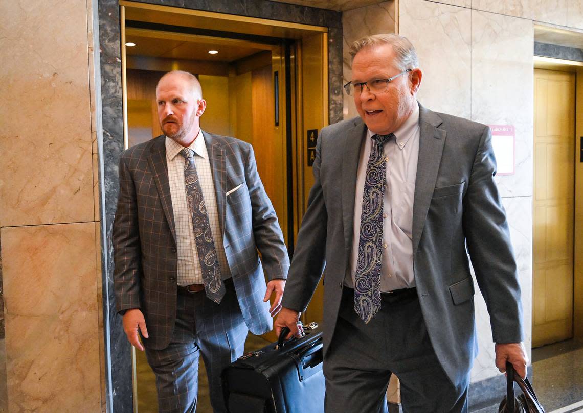 Britt Reid, left, walks to a courtroom with his attorney J.R. Hobbs on Tuesday at the Jackson County Courthouse to be sentenced. The former assistant coach and son of head coach Andy Reid in September pleaded guilty to driving while intoxicated and causing a 2021 crash that severely injured a 5-year-old girl.