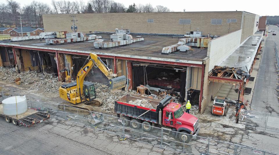The west walls of the former Kingsgate Cinema are demolished Dec. 13, exposing the seats of one of the theaters