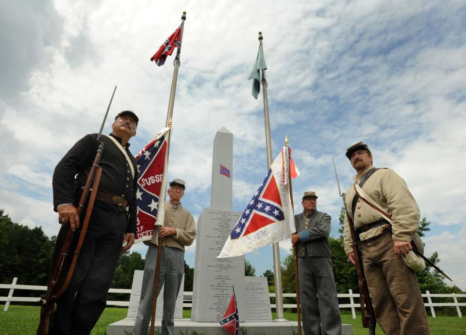 Members of Delaware Grays Camp 2068, Sons of Confederate Veterans of Seaford, stand in front of the camp's memorial site in Georgetown. Joining camp commander Jeff Plummer, right, are, from left, John Zoch, Richard Jamison and Mark Brown.