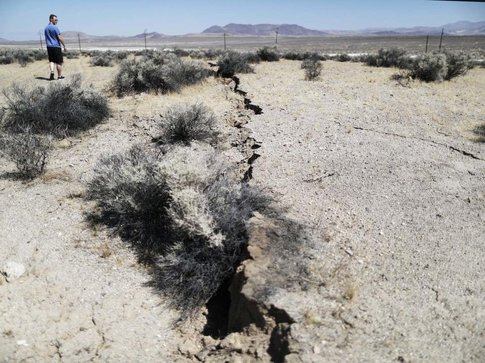 Repeated earthquakes could risk releasing deadly radioactivity into the earth if plans for a nuclear waste site in go ahead in Nevada’s desert, the state’s governor has warned.Tens of thousands of tons of highly radioactive used nuclear reactor fuel are due to be transferred from 35 US states to a new facility in the Mojave Desert.The Yuka Mountain nuclear waste repository is set to store this material deep within the earth. But a series of recent earthquakes in the Mojave Desert has raised concerns about the safety of storing radioactive waste at the facility. On 4 July, a 7.1 magnitude earthquake ruptured the earth in the desert, which stretches across the California-Nevada border.The force of the quake cracked buildings, sparked fires, damaged roads and caused several injuries in southern California. It was followed by a 6.4-magnitude temblor two days later.In the wake of the earthquakes, the governor of Nevada Steve Sisolak said he was committed to “fighting any continued federal effort to use Nevada as the nation's nuclear dumping ground".“These significant recent earthquakes so near to Yucca Mountain show one of the many geologic problems with the site as a nuclear waste repository,” he said.Mr Sisolak sent a letter to the energy secretary, Rick Perry, urging him to reconsider the location of the facility.The US government began considering sites for storing radioactive waste that is produced as old nuclear fuel is reprocessed into nuclear weapon materials in 1982.In 2002, Yuka Mountain was designated as the only site in the country to receive the radioactive material. But Nevada has fought the proposed nuclear waste repository at every step, arguing that US government studies downplayed the risk of earthquakes damaging the repository and releasing deadly radioactivity. The project was shelved in 2010 under pressure from then-Senate Democratic Majority Leader Harry Reid of Nevada and Barack Obama. They said nuclear waste should be stored in a state that wants it. But in March 2019, Mr Perry, the Trump administration's energy secretary, set aside $116m to push forward the project and restart licensing hearings.In governor of Nevada’s letter to Mr Perry, he included the opinions of James Faulds at the Nevada Bureau of Mines and Geology and Graham Kent at the seismological laboratory at the University of Nevada.They urged for more research to be conducted into the seismic activity at the Yuka Mountain site. "The Ridgecrest earthquake sequence, which began July 4 and has yet to subside, clearly highlights the importance of such studies," Mr Faulds and Mr Kent said. A recent ranking compiled by the US Geological Survey found Nevada was the US state with the fourth highest level of seismic activity after Alaska, Wyoming and Oklahoma.Additional reporting by AP