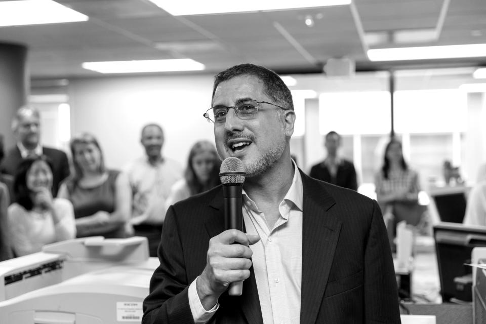 After the Pulitzer Prize for Public Service was awarded to The Washington Post, reporters and editors gather in the newsroom in Washington, Monday, April 14, 2014, as contributing writer Barton Gellman describes the effort that went into a series of stories on the government's massive surveillance program based on information leaked by National Security Agency employee Edward Snowden. (J. Scott Applewhite/AP)