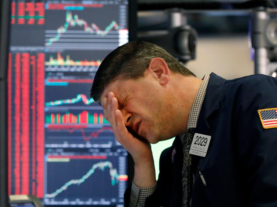 Trader Michael Gallucci works at his post on the floor of the New York Stock Exchange, Wednesday, March 11, 2020. Stocks are closing sharply lower on Wall Street, erasing more than 1,400 points from the Dow industrials, as investors wait for a more aggressive response from the U.S. government to economic fallout from the coronavirus. (AP Photo/Richard Drew)