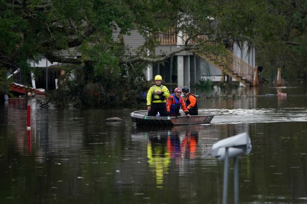 People conducting an animal rescue operation drive a boat down a flooded street in the aftermath of Hurricane Ida, Wednesday, Sept. 1, 2021, in Lafitte, Louisiana. (Photo: AP Photo/John Locher)