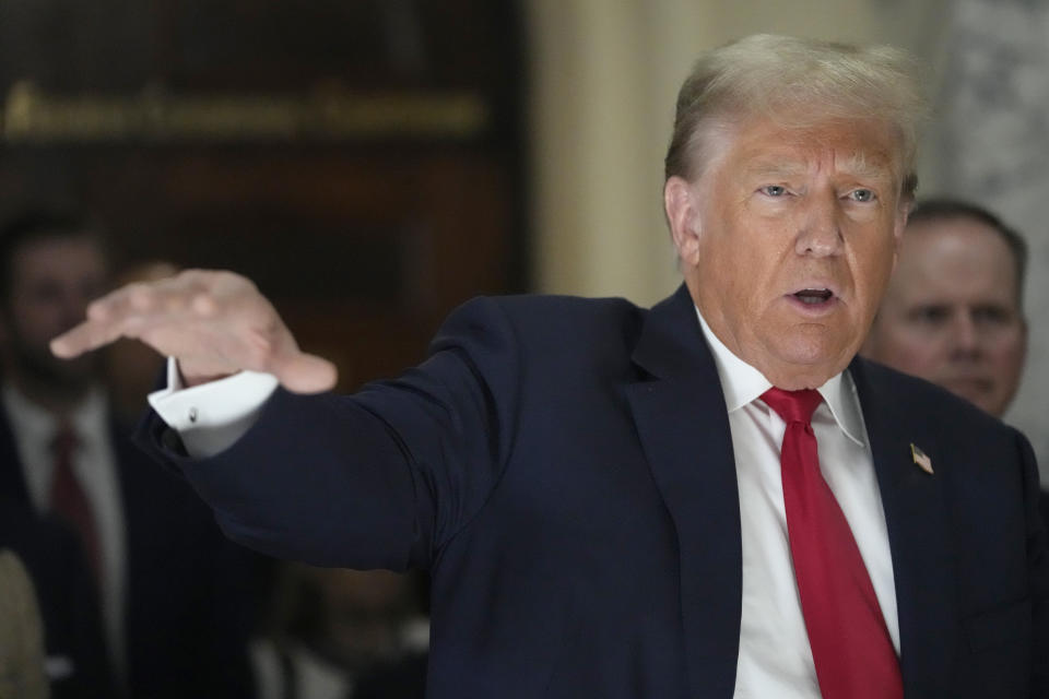 Former President Donald Trump speaks to reporters as he leaves the courtroom during a lunch break in his civil business fraud trial, Wednesday, Oct. 4, 2023, in New York. (AP Photo/Mary Altaffer)