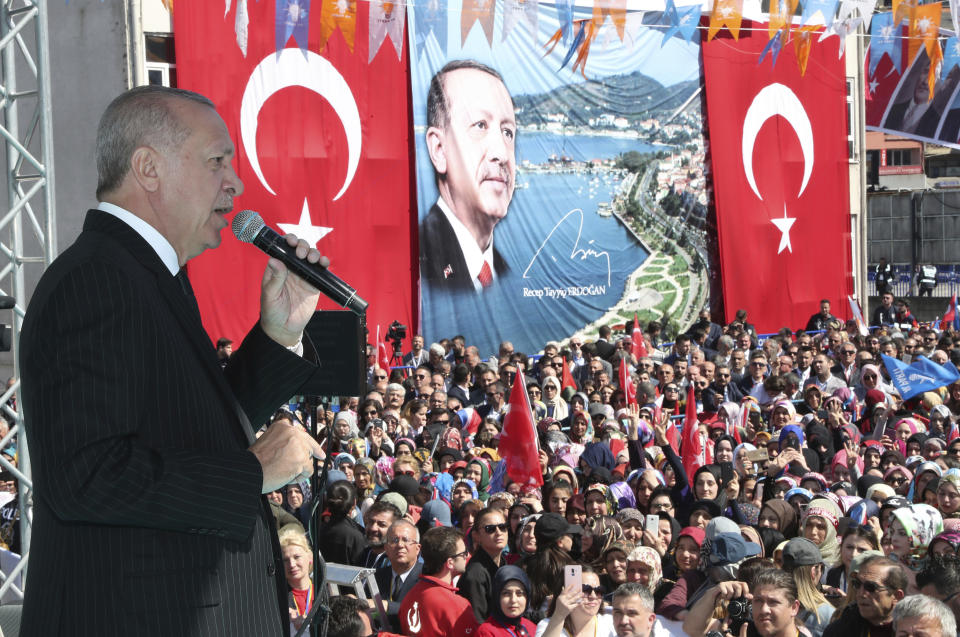 Turkey's President Recep Tayyip Erdogan addresses the supporters of his ruling Justice and Development Party during a rally in Eregli, Turkey, Tuesday, March 19, 2019. Ignoring widespread criticism, Erdogan has again shown excerpts of a video taken by the attacker who killed 50 people in mosques in New Zealand at a campaign rally. (Presidential Press Service via AP, Pool)