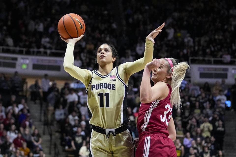 Purdue guard Lasha Petree (11) shoots over Indiana guard Sydney Parrish (33) in the second half of an NCAA college basketball game in West Lafayette, Ind., Sunday, Feb. 5, 2023. Indiana defeated Purdue 69-46. (AP Photo/Michael Conroy)