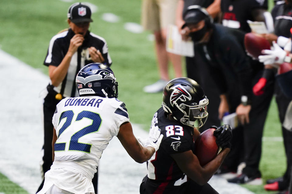 Atlanta Falcons wide receiver Russell Gage (83) makes the catch against Seattle Seahawks cornerback Quinton Dunbar (22) during the second half of an NFL football game, Sunday, Sept. 13, 2020, in Atlanta. (AP Photo/Brynn Anderson)