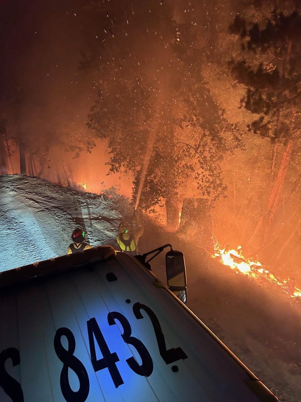 Firefighters battle the 2023 Happy Camp Complex, burning in the Klamath National Forest.