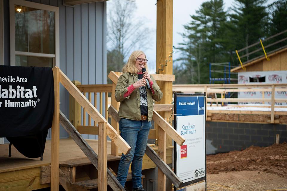 Co-director of Beloved Asheville Amy Cantrell says a few words to a crowd at Asheville Area Habitat for Humanity's jobsite in West Asheville prior to a wall raising of the Christmas Jam House.
