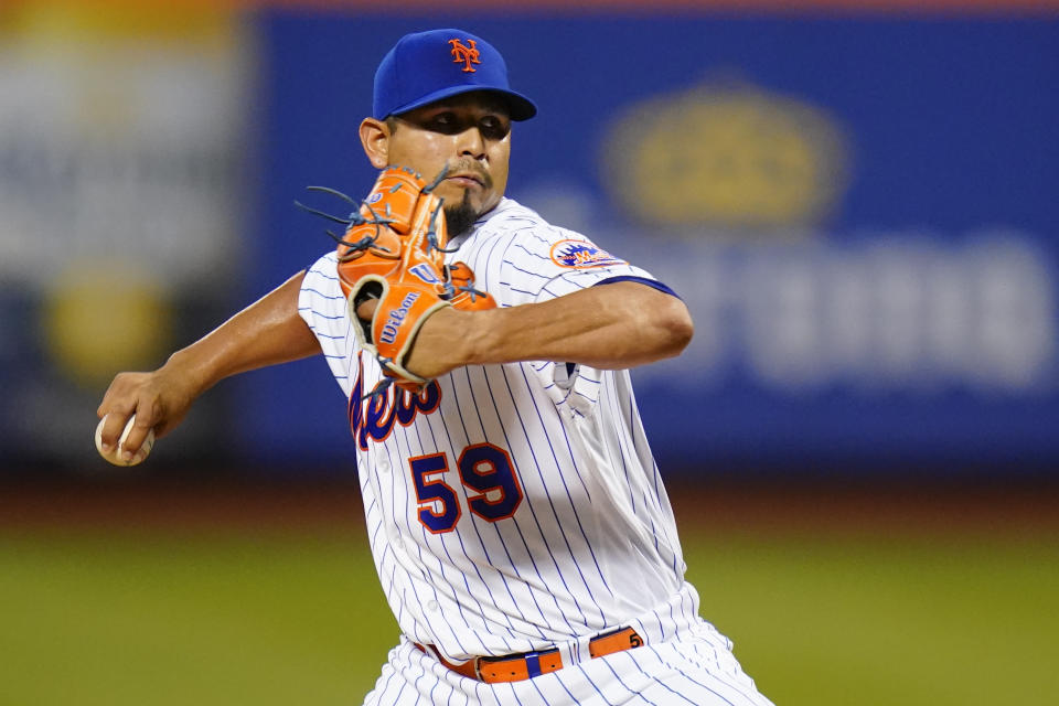 New York Mets' Carlos Carrasco pitches during the first inning of the team's baseball game against the Cincinnati Reds on Tuesday, Aug. 9, 2022, in New York. (AP Photo/Frank Franklin II)