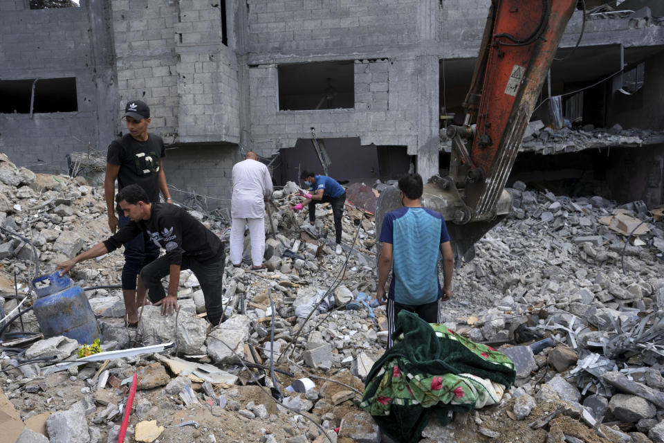 Palestinians recover the bodies of the al Meghari family killed in the Israeli bombardment of the Gaza Strip in Bureij refugee camp, Gaza Strip, Tuesday, Nov. 14, 2023. U.N. humanitarian monitors say at least 2,700 people, including 1,500 children, are missing and believed buried under the rubble. (AP Photo/Adel Hana)