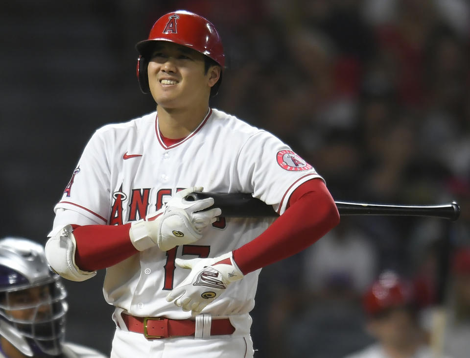 Los Angeles Angels' Shohei Ohtani reacts to a pitch in the fourth inning of the team's baseball game against the Colorado Rockies Wednesday, July 28, 2021, in Anaheim, Calif. (AP Photo/John McCoy)