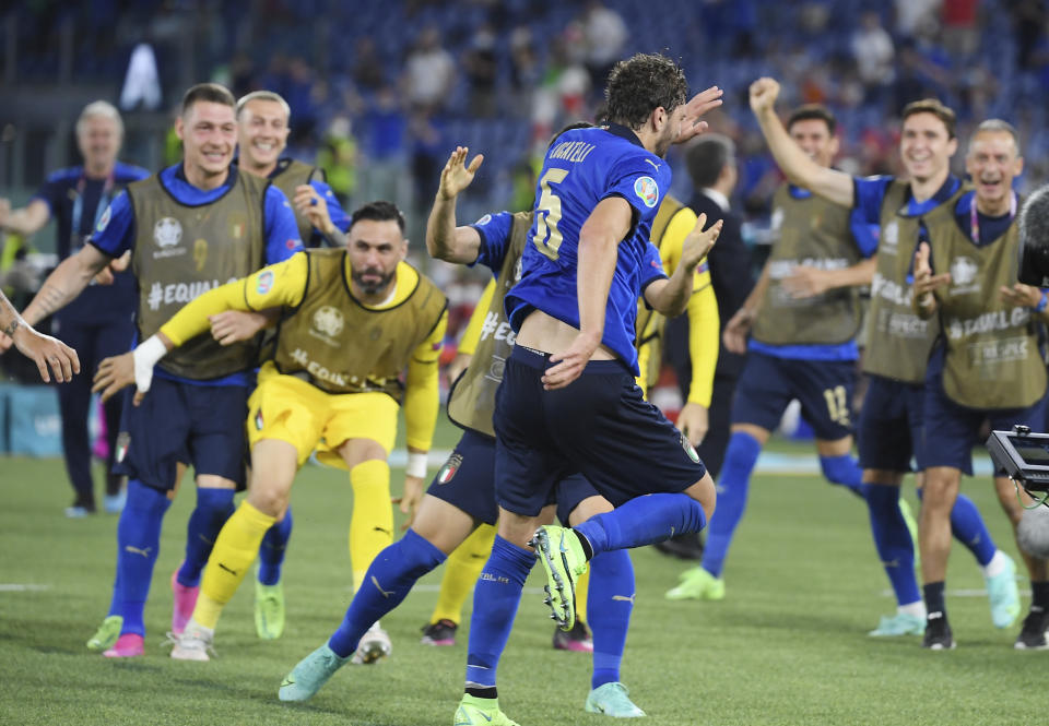 Italy's Manuel Locatelli celebrates with his teammates after scoring his side's opening goal during the Euro 2020 soccer championship group A match between Italy and Switzerland at Olympic stadium in Rome, Wednesday, June 16, 2021. (Ettore Ferrari, Pool via AP)