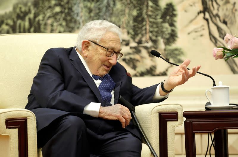 FILE PHOTO: Former U.S. Secretary of State Henry Kissinger speaks during a meeting with Chinese Foreign Minister Wang Yi in Beijing
